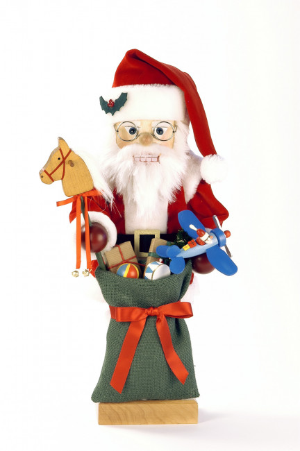 ussknacker Weihnachtsmann mit grünen Spielzeugsack