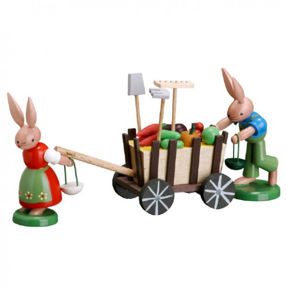 Hasenfamilie mit Erntewagen