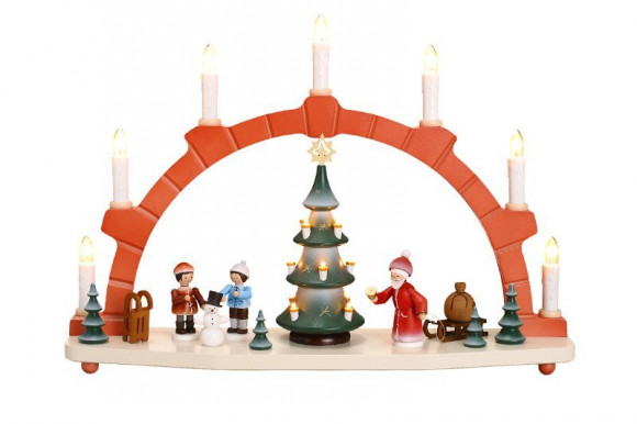 Schwibbogen mit beleuchtetem Baum und Winterkindern