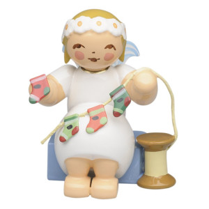 Margeritenengel sitzend mit stilisiertem Adventskalender