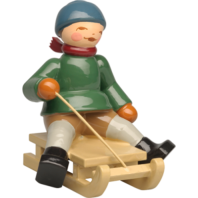 Winterkinder Junge auf Schlitten