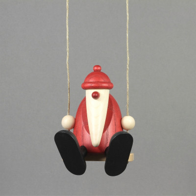 Weihnachtsmann auf Schaukel