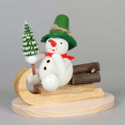 Schneemann auf Holzschlitten